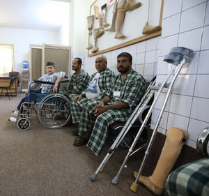 Jasmin and other patients wait for their prosthetic limbs at the emergency orthopaedic centre in Sulymania