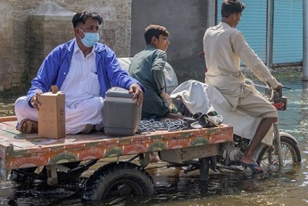 men-in-flooded-street men-in-flooded-street