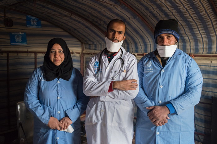 Houriyah from Aleppo (left) Haitham from Raqqa (centre) and Nasser from Deir Ezzor work at a the mobile clinic in Ain Issa Camp