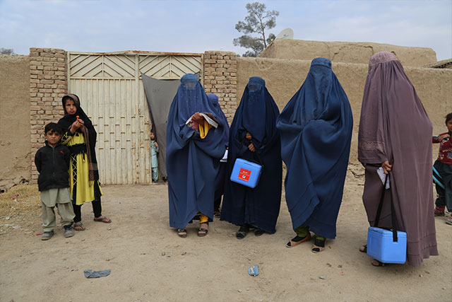 Zainab (right) with one of her teams getting ready for a house visit.