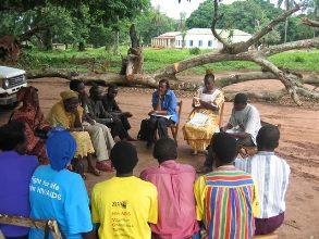 Health workers talking to local communities on outbreaks and risks of transmission