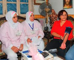 Nurses measuring blood pressure of a patient