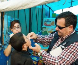 A child in Iraq receives oral cholera vaccine