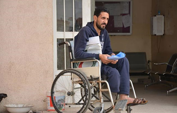 A man in need of a prosthetic leg visits the Mosul Rehabilitation Centre for a routine check and registration update 