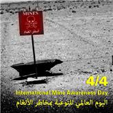 A red flag stuck into the ground indicates the possible presence of a landmine