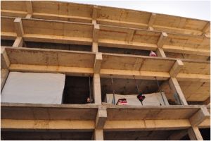 They_are_constrained_to_use_sheets_of_cloths_in_lieu_of_doors_or_walls_to_protect_their_children_from_injuries_that_could_be_caused_by_falling_objects