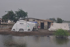 Roadside camps in Thatta, Sindh, surrounded by floodwater in 2011