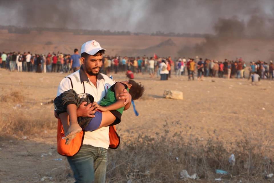 PRCS paramedic evacuating an injured child from field