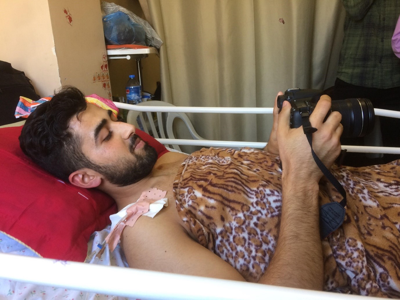 Journalist denied exit from Gaza for health care loses his left leg from a gunshot wound