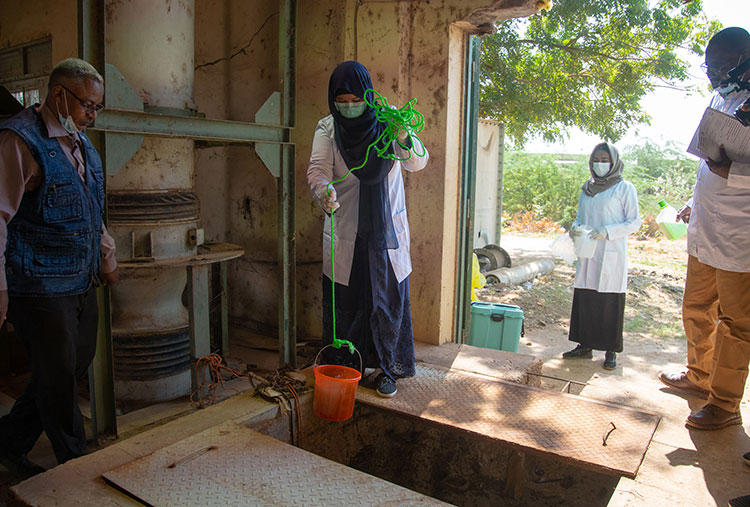 Between one and two litres of sewage runoff is poured into a labelled jerrycan. It is then sealed, wiped down and transported to the National Polio Laboratory in reverse cold chain