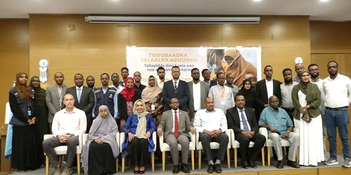 Minister of Health Dr Ali Hajiadam Abubakar poses for a group photo with health partners to kick-start World Immunization Week 2024 in Mogadishu, Somalia. Photo credit: UNICEF/Maslah