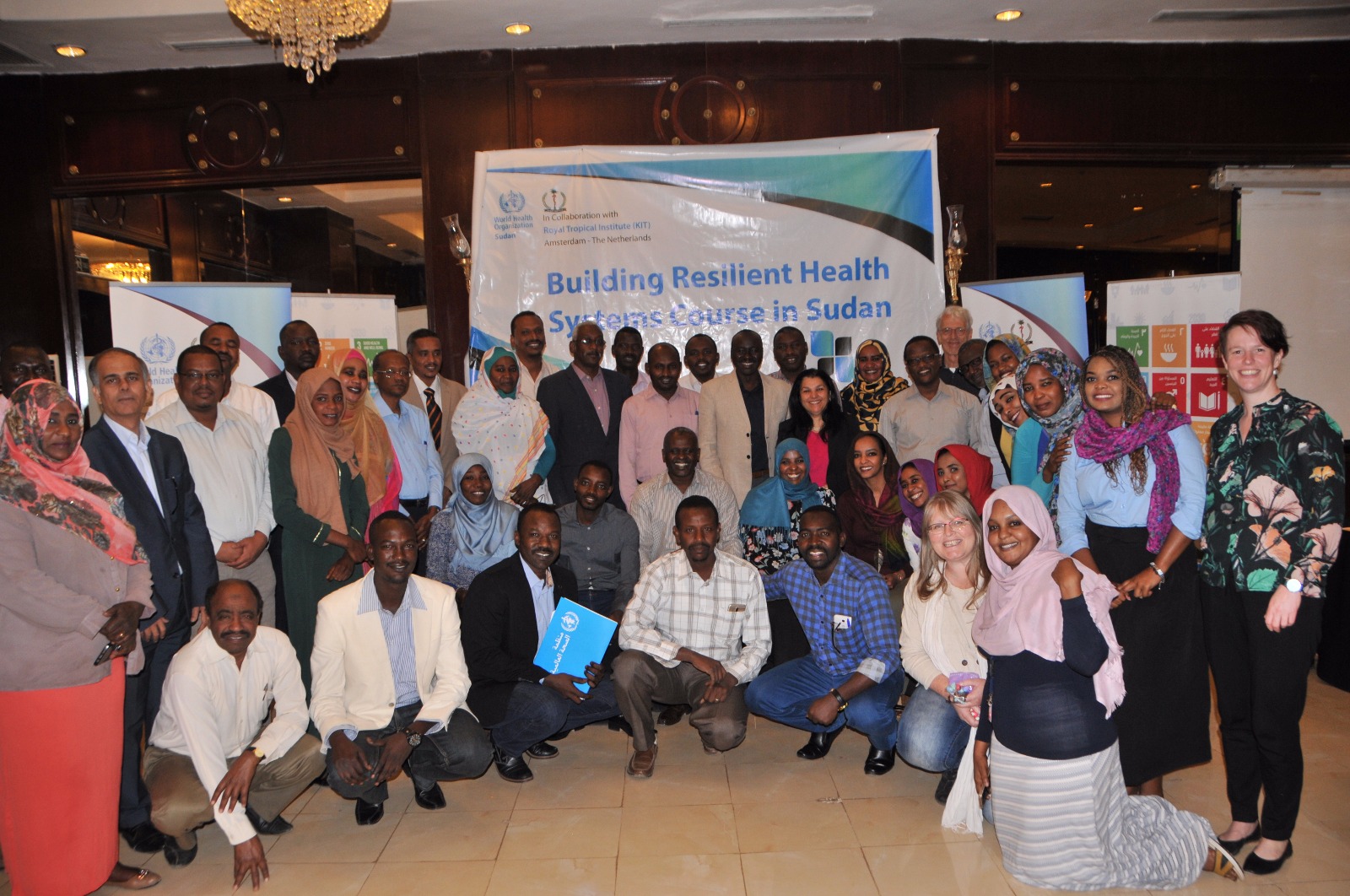 All course participants, organizers, and Dr. Naeema Al Gasseer (centre in black and pink) (Photo: Simon van Woerden/WHO Sudan).