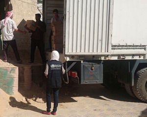 WHO shipment reaching Douma in east Ghouta. Offloading WHO medical shipment in Douma. 