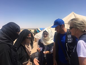 WHO representative in Syria (right) accompanied by WHO trauma officer and member of an NGO medical team with IDPs in Al- Bahra camp